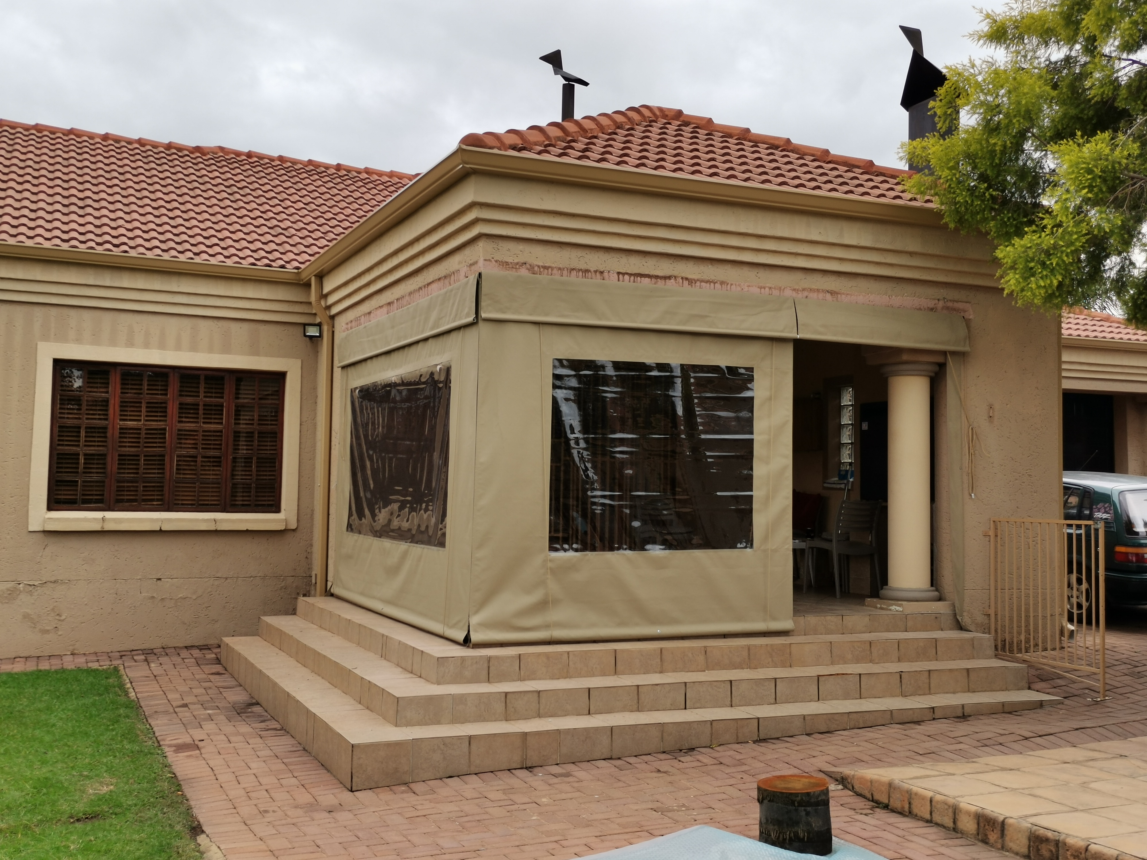 New canvas and clear PVC patio enclosure installed by First Choice Blinds SA